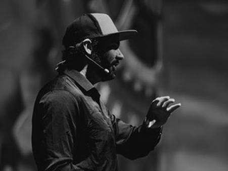 Speaker presenting at an industry conference
